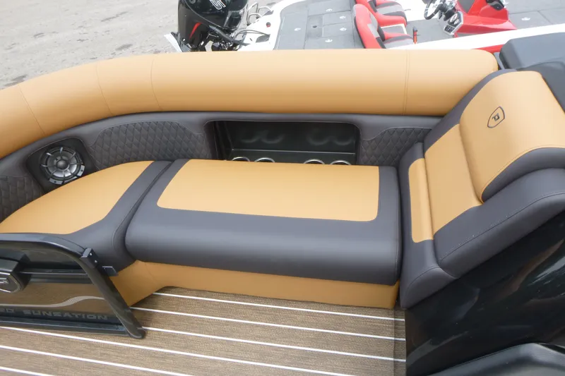 Slide: The Image of Luxurious seating on 2027 Premier 230 Sunsation RS - CL boat, featuring tan and gray upholstery. - 8