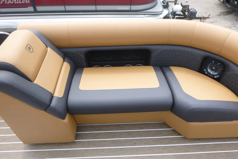 Slide: The Image of Luxurious seating on 2027 Premier 230 Sunsation RS - CL pontoon boat, featuring tan and gray upholstery. - 9