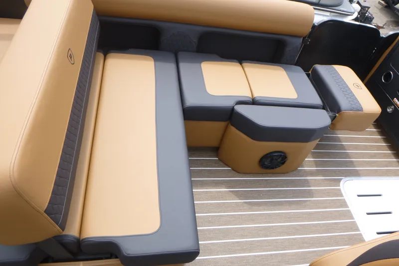 Slide: The Image of Luxurious seating on 2027 Premier 230 Sunsation RS - CL boat, featuring tan and gray upholstery. - 13