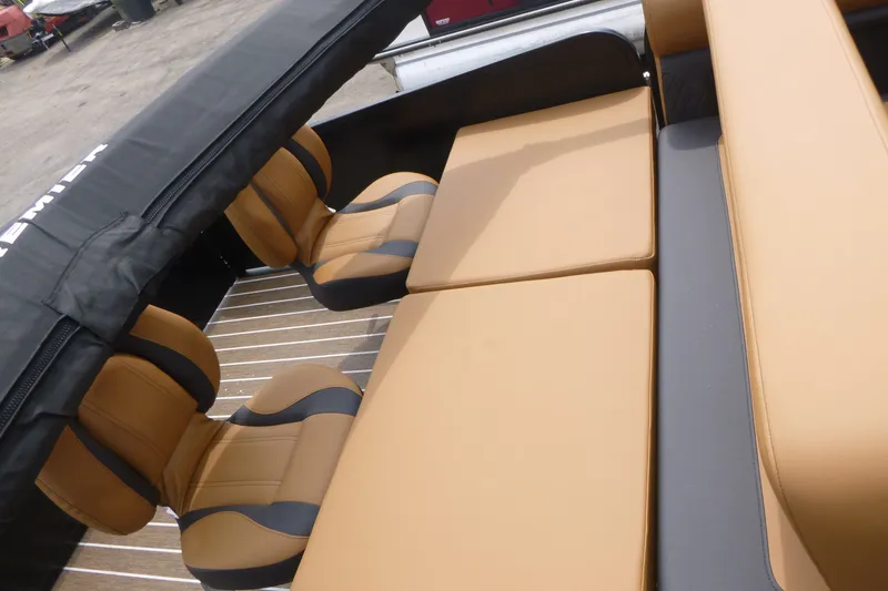 Slide: The Image of Luxurious seating on 2027 Premier 230 Sunsation RS - CL pontoon boat, featuring tan upholstery. - 16