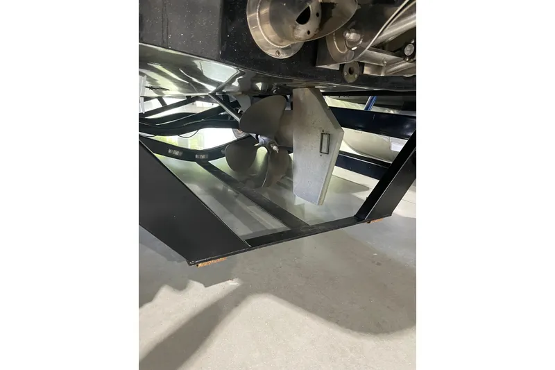Slide: The Image of Underside view of 2015 Malibu Wakesetter 24 MXZ boat propeller and rudder. - 8