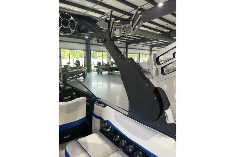 Slide: The Image of 2015 Malibu Wakesetter 24 MXZ interior with wakeboard tower in showroom. - 22