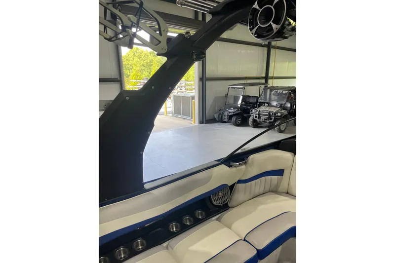 Slide: The Image of Interior of 2015 Malibu Wakesetter 24 MXZ boat with seating and speaker system. - 23