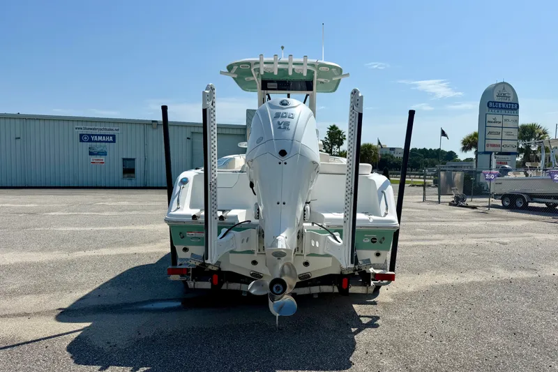 Slide: The Image of 2023 Sea Hunt Ultra 239SE boat with Yamaha engine, parked at Bluewater Yacht Sales. - 4