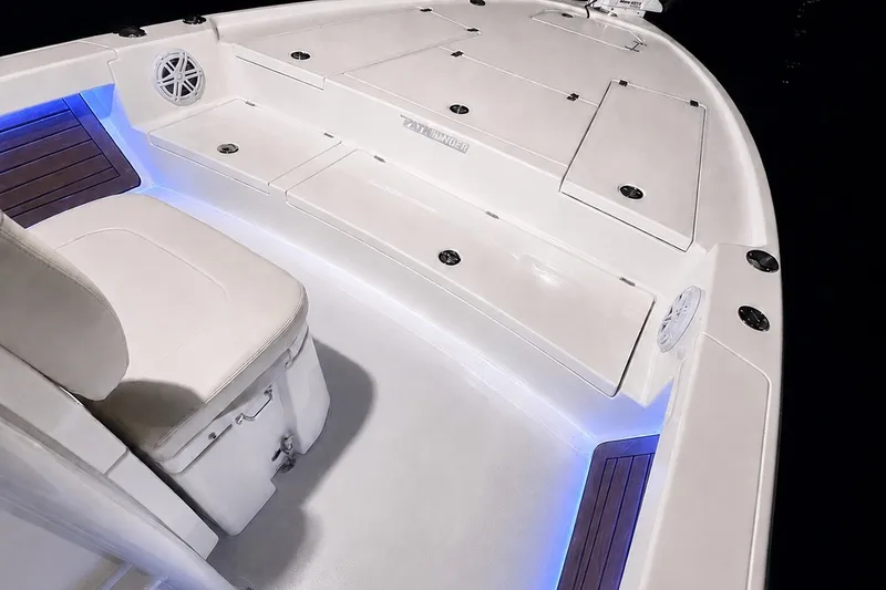 Slide: The Image of 2023 Pathfinder 2500 Hybrid boat interior with illuminated seating and storage compartments. - 33