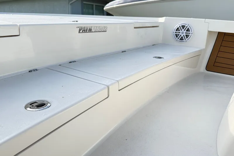 Slide: The Image of 2023 Pathfinder 2500 Hybrid boat interior with storage compartments and speaker. - 35