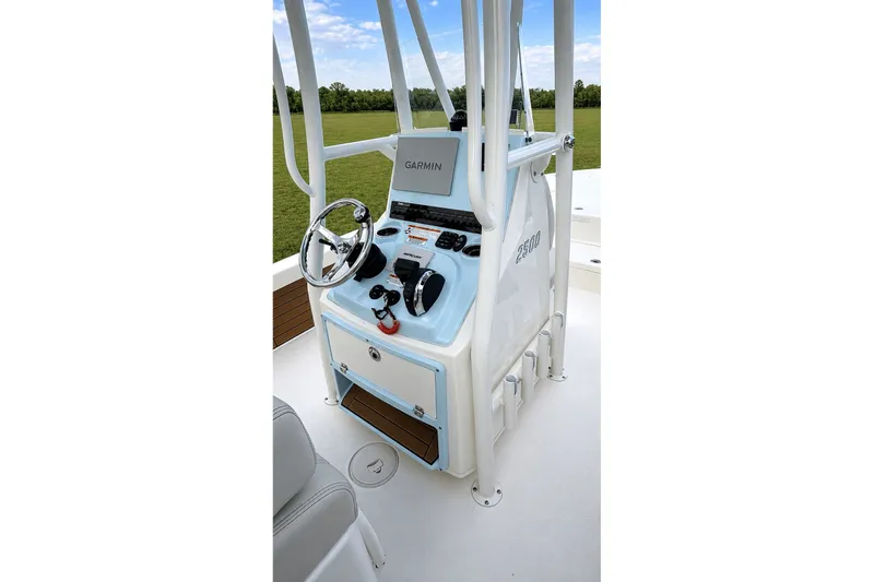 Slide: The Image of 2023 Pathfinder 2500 Hybrid boat console with Garmin navigation system and steering wheel. - 42