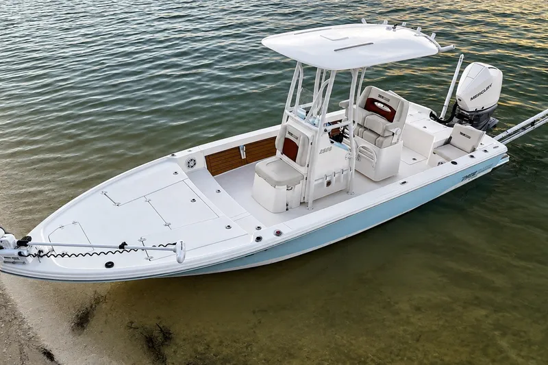 Slide: The Image of 2023 Pathfinder 2500 Hybrid boat docked on calm water. - 10