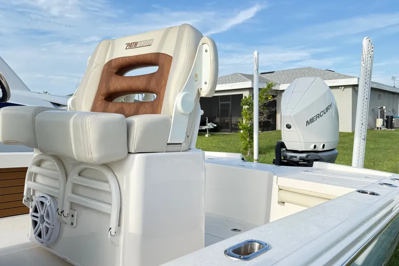 Slide: The Image of 2023 Pathfinder 2500 Hybrid boat with Mercury engine, featuring a comfortable captain's chair. - 39