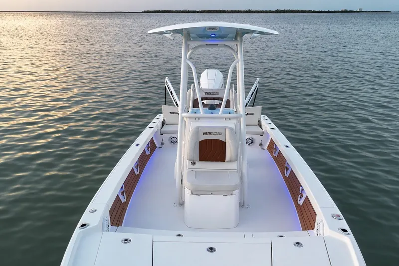 Slide: The Image of 2023 Pathfinder 2500 Hybrid boat on calm water at sunset. - 17