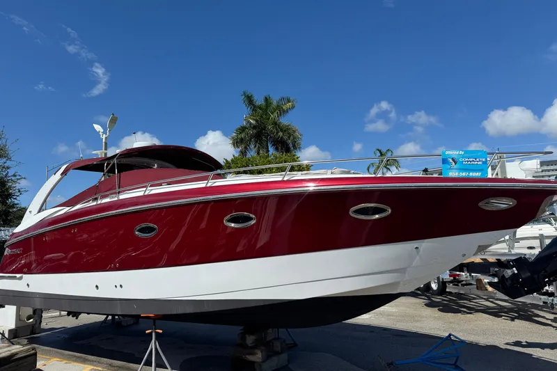 Slide: The Image of 2005 Cobalt 360 Cruiser boat on display under clear blue sky. - 1