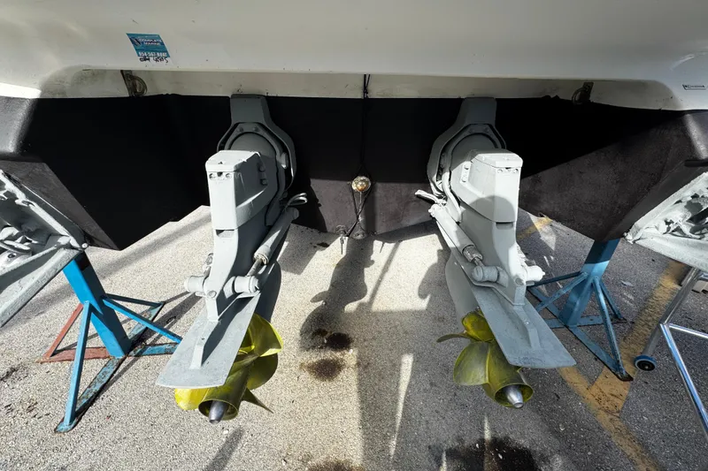 Slide: The Image of 2005 Cobolt 36 boat with dual outboard motors on stands. - 34