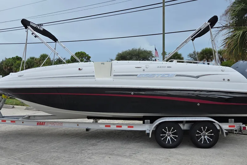 The Image of 2009 Ebbtide 2400 SS Fun Cruiser O/B on trailer, side view. - 1