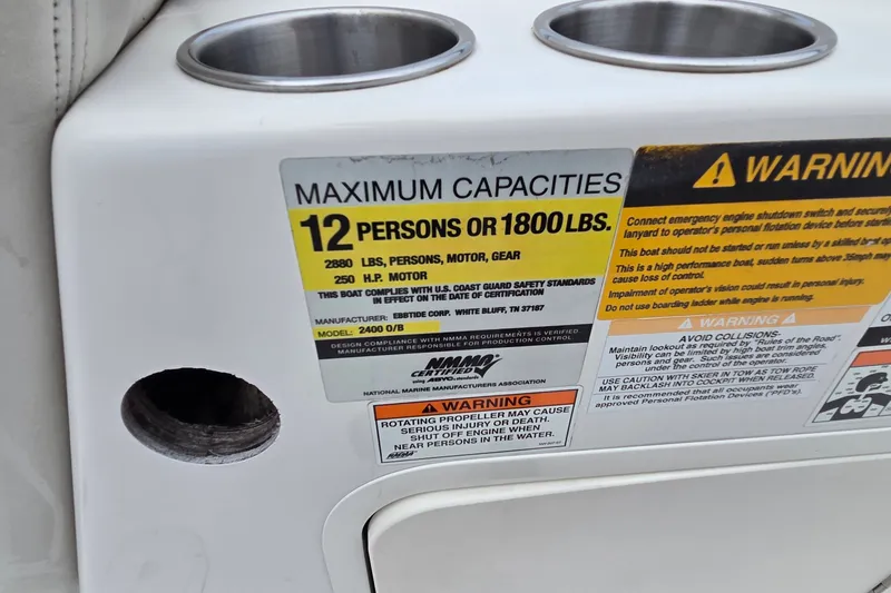 Slide: The Image of 2009 Ebbtide 2400 SS Fun Cruiser O/B capacity label, 12 persons or 1800 lbs. - 5
