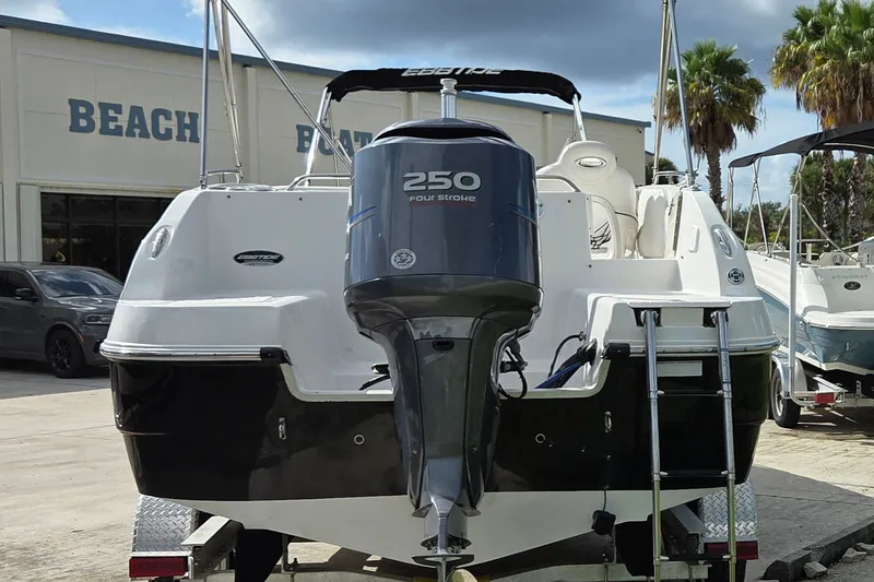 Slide: The Image of 2009 Ebbtide 2400 SS Fun Cruiser O/B with 250 horsepower engine at a boat dealership. - 3