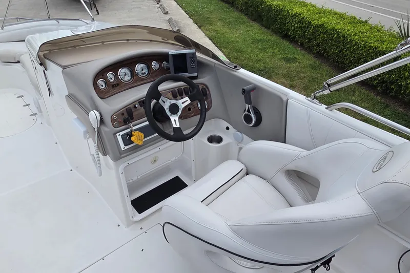 Slide: The Image of 2009 Ebbtide 2400 SS Fun Cruiser O/B boat cockpit with steering wheel and gauges. - 8