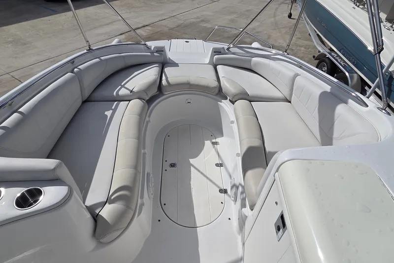 Slide: The Image of 2009 Ebbtide 2400 SS Fun Cruiser O/B boat interior with spacious seating. - 15