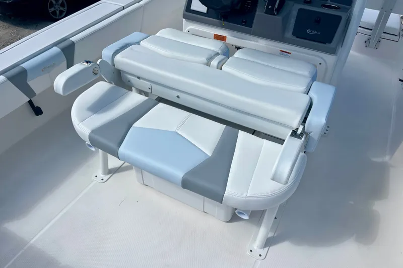 Slide: The Image of 2027 Robalo 266 Cayman boat seating with white and gray upholstery. - 19