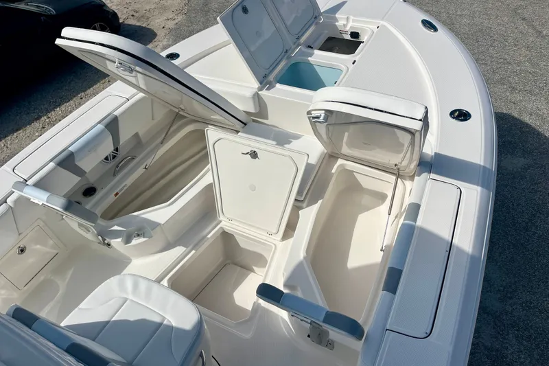 Slide: The Image of 2027 Robalo 266 Cayman boat interior with open storage compartments and seating. - 31