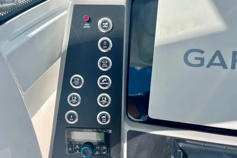 Slide: The Image of Control panel of 2027 Robalo 266 Cayman boat with various function buttons. - 26