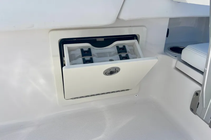 Slide: The Image of 2027 Robalo 266 Cayman boat storage compartment with open hatch. - 39