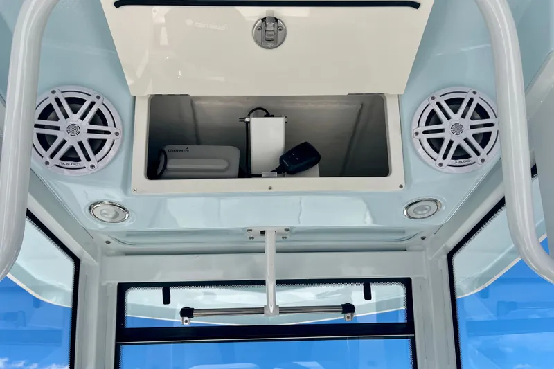 Slide: The Image of Interior view of 2027 Robalo 266 Cayman boat with speakers and storage compartment. - 28