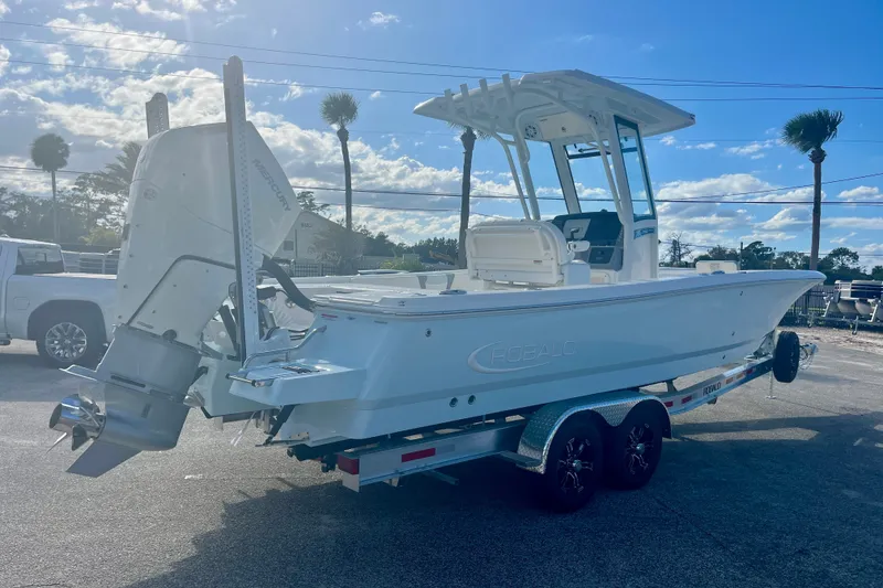 Slide: The Image of 2027 Robalo 266 Cayman boat on trailer under blue sky. - 5