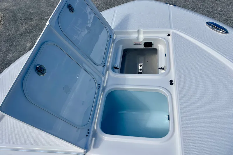 Slide: The Image of Open storage compartments on 2027 Robalo 266 Cayman boat deck. - 34