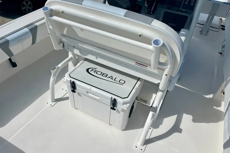 Slide: The Image of 2027 Robalo 266 Cayman boat interior with seating and storage compartment. - 18