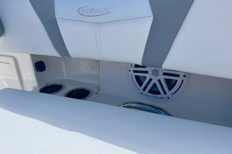 Slide: The Image of 2027 Robalo 266 Cayman boat interior with speaker and cup holders. - 35