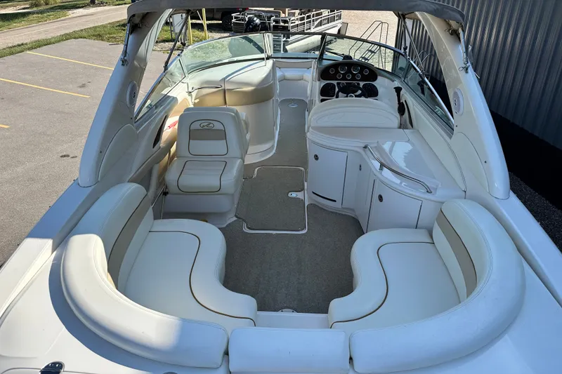 Slide: The Image of 2001 Sea Ray 290 Bowrider interior with spacious seating and modern dashboard. - 5