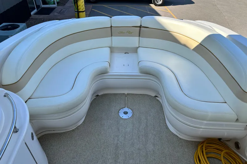 Slide: The Image of Luxurious seating area on a 2001 Sea Ray 290 Bowrider boat. - 9