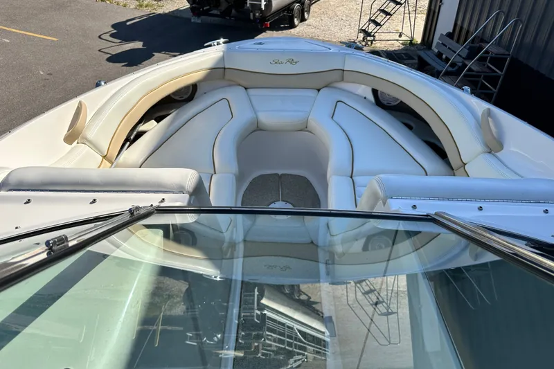Slide: The Image of 2001 Sea Ray 290 Bowrider with spacious white seating and sleek design. - 13