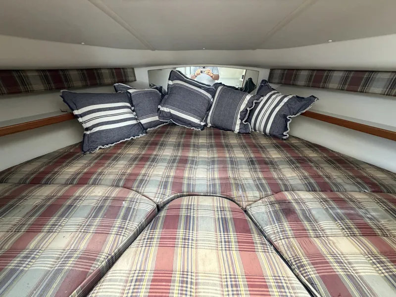 Slide: The Image of Cozy cabin with plaid upholstery and striped pillows, perfect for relaxing. - 17
