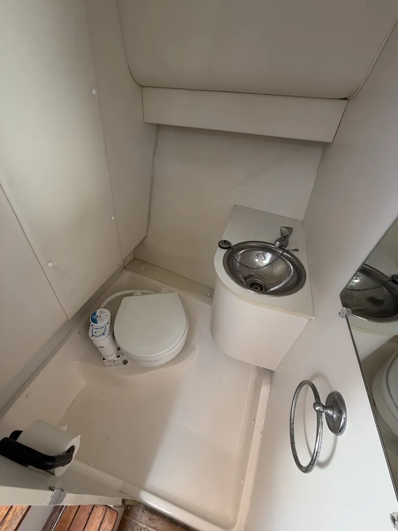 Slide: The Image of Bathroom in a 2000 Tiara Yachts 2900 Coronet with toilet and sink. - 20