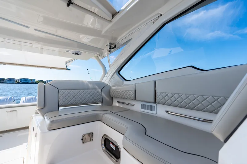 Slide: The Image of Luxurious interior of 2021 Pursuit DC 365 Dual Console boat with quilted seating. - 32