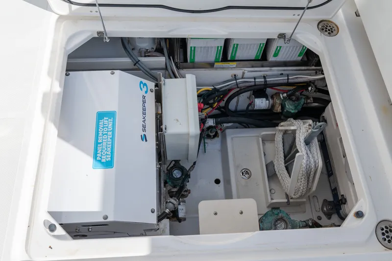 Slide: The Image of Engine compartment of 2021 Pursuit DC 365 Dual Console with Seakeeper 3 stabilizer system. - 23