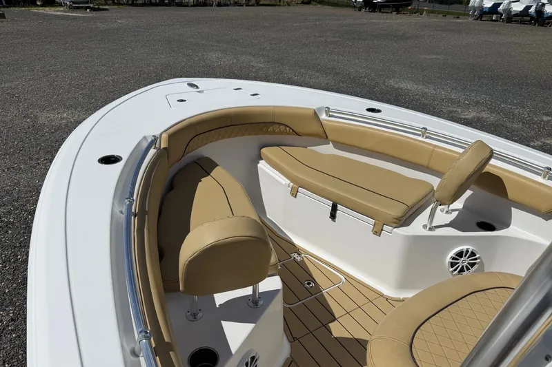 Slide: The Image of 2022 Sportsman Open 212 Center Console boat with tan seating and spacious deck. - 1