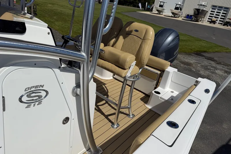 Slide: The Image of 2022 Sportsman Open 212 Center Console boat with tan seating and sleek design. - 8