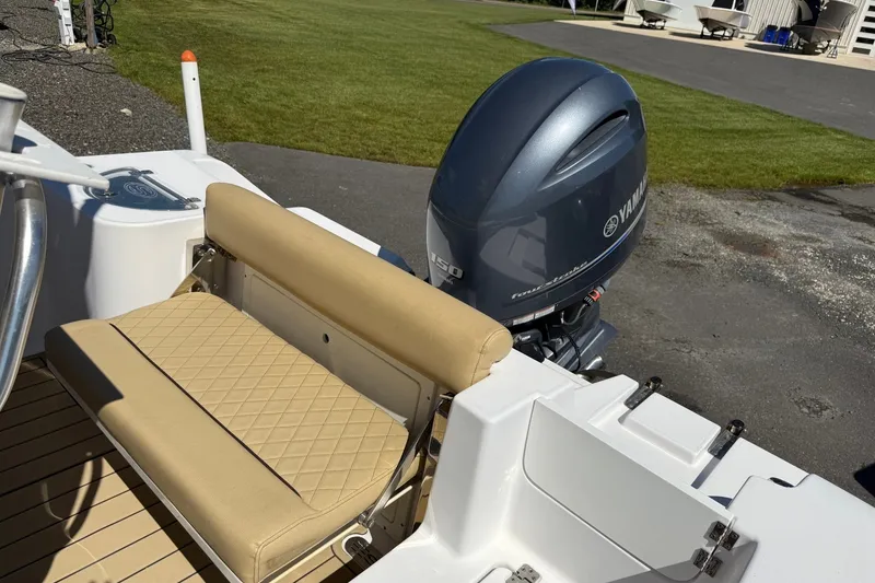 Slide: The Image of 2022 Sportsman Open 212 Center Console with Yamaha outboard motor and tan seating. - 16