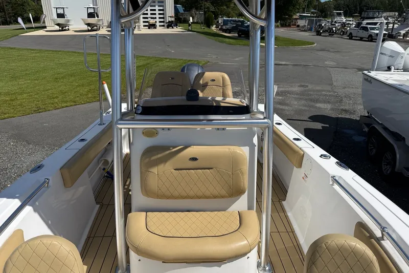 Slide: The Image of 2022 Sportsman Open 212 Center Console boat with tan seating and sleek design. - 6