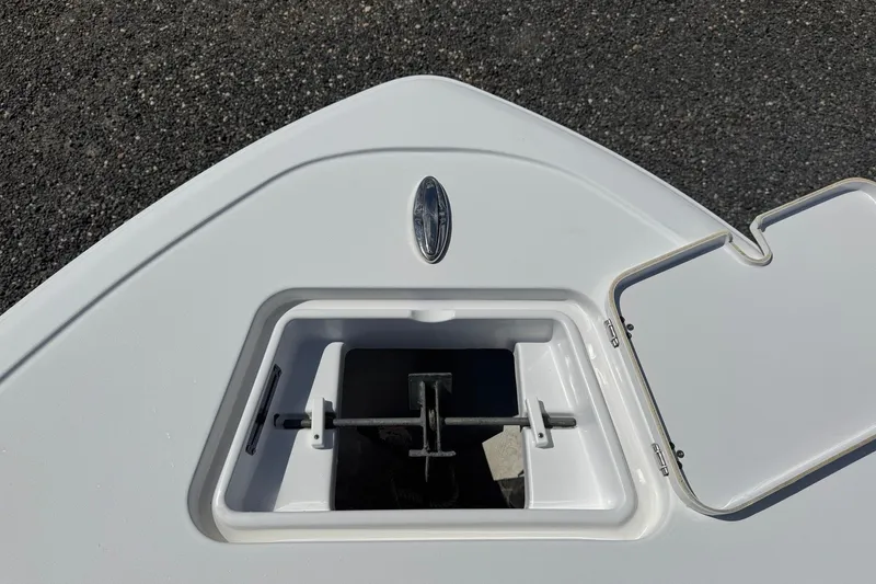 Slide: The Image of The image shows the anchor locker of a 2022 Sportsman Open 212 Center Console boat. - 5