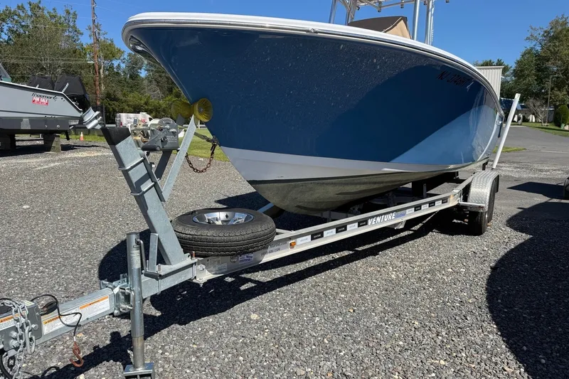 Slide: The Image of A 2022 Sportsman Open 212 Center Console boat on a trailer, ready for transport. - 21