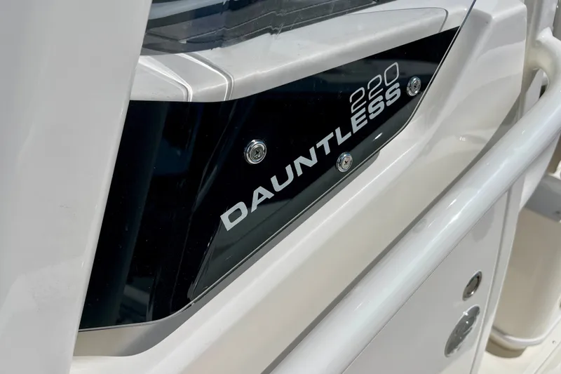 Slide: The Image of Close-up of 2027 Boston Whaler 220 Dauntless boat nameplate. - 29