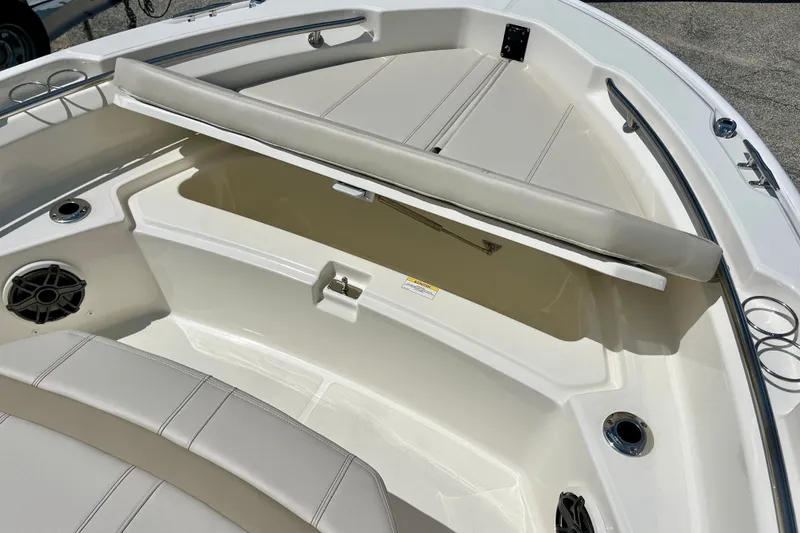 Slide: The Image of 2027 Boston Whaler 220 Dauntless boat interior with open storage compartment. - 25