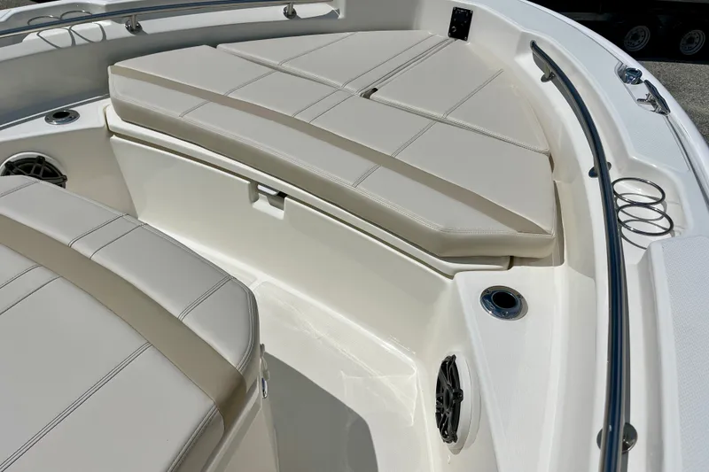 Slide: The Image of Interior view of 2027 Boston Whaler 220 Dauntless boat with cushioned seating. - 23