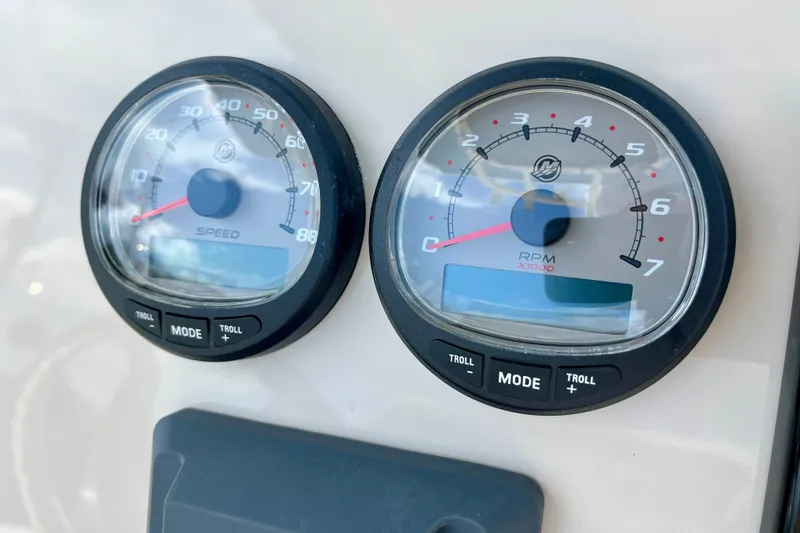 Slide: The Image of Close-up of speedometer and tachometer on 2027 Boston Whaler 220 Dauntless boat. - 17