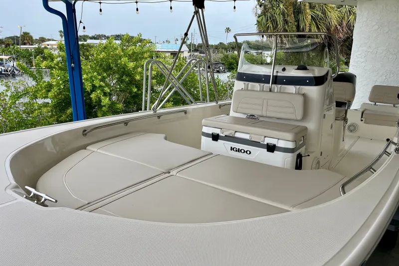 Slide: The Image of 2027 Boston Whaler 190 Montauk boat interior with seating and Igloo cooler. - 4