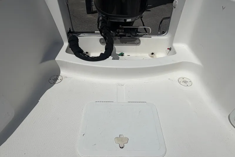 Slide: The Image of 2005 Sea Fox 197 Center Console boat interior with motor and storage hatch. - 40