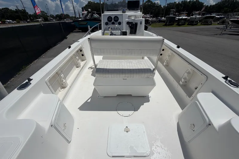 Slide: The Image of 2005 Sea Fox 197 Center Console boat interior with seating and storage compartments. - 12